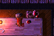 One hunter working on a cadaver, with another carting resources away.
